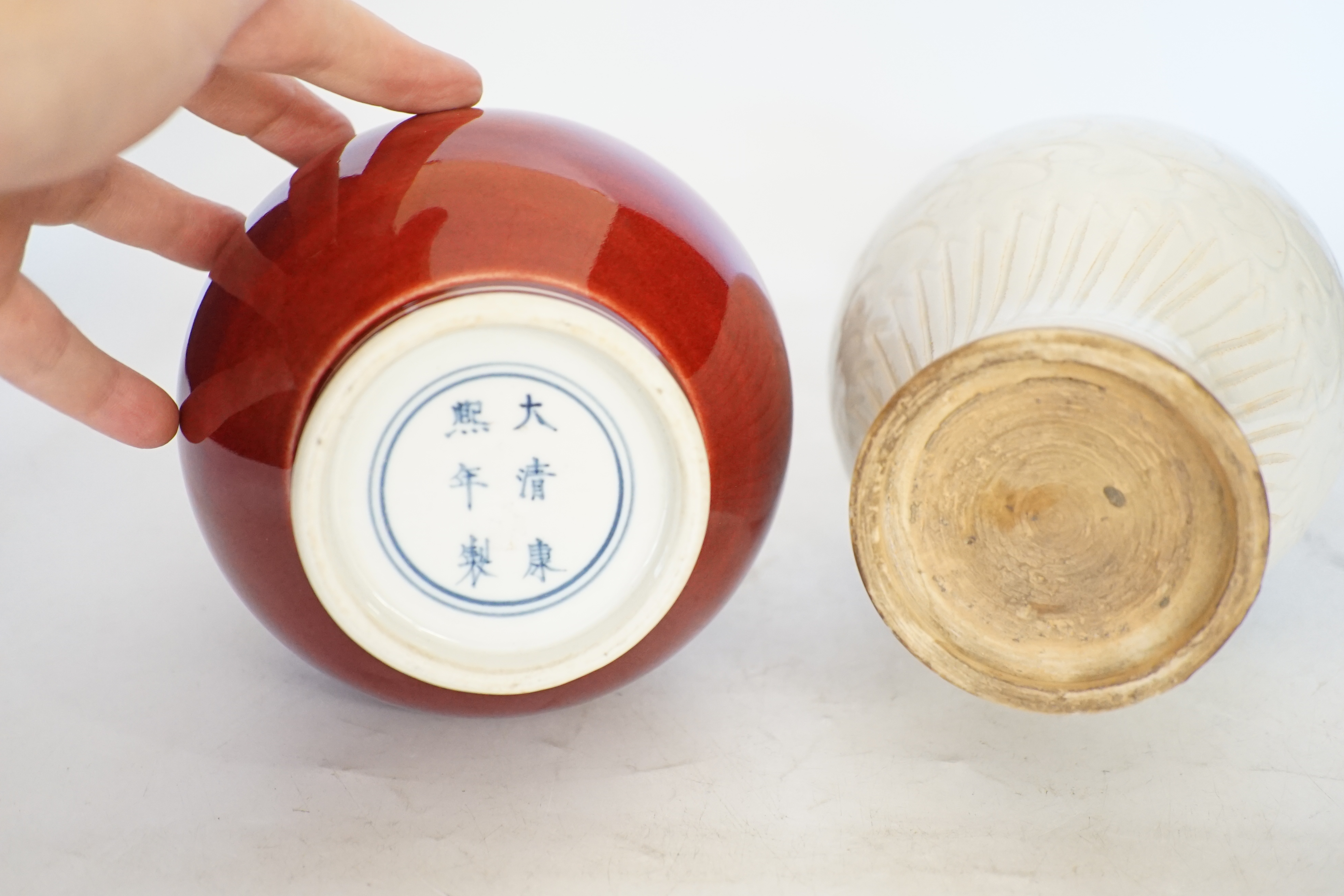 Two Chinese vases including a sang de boeuf example, largest 25cm high. Condition - larger example good, other with crazing